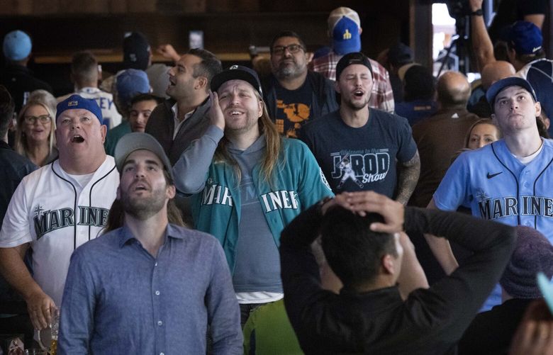 Fans look unhappy at the Queen Anne Beerhall in Queen Anne after they did not score in the ninth inning. Unfortunately, the Houston Astros did and they won the game, 8 – 7. The M’s had the lead until the ninth inning. The M’s played in the first game in their playoff best of five series against the Houston Astros in Houston Tuesday, October 11, 2022. 221814