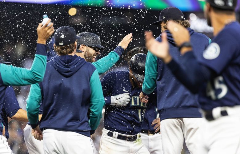 Abraham Toro gets the celebration shower after his sacrifice fly scored the winning run in Game 1 against Detroit. 221663