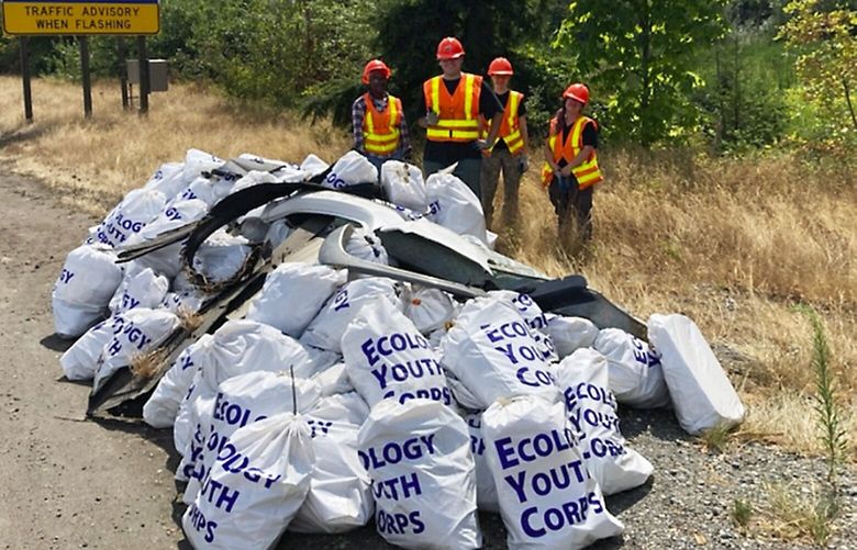 An Ecology Youth Corps crew will frequently collect a hundred or more bags of litter per day from state highways.