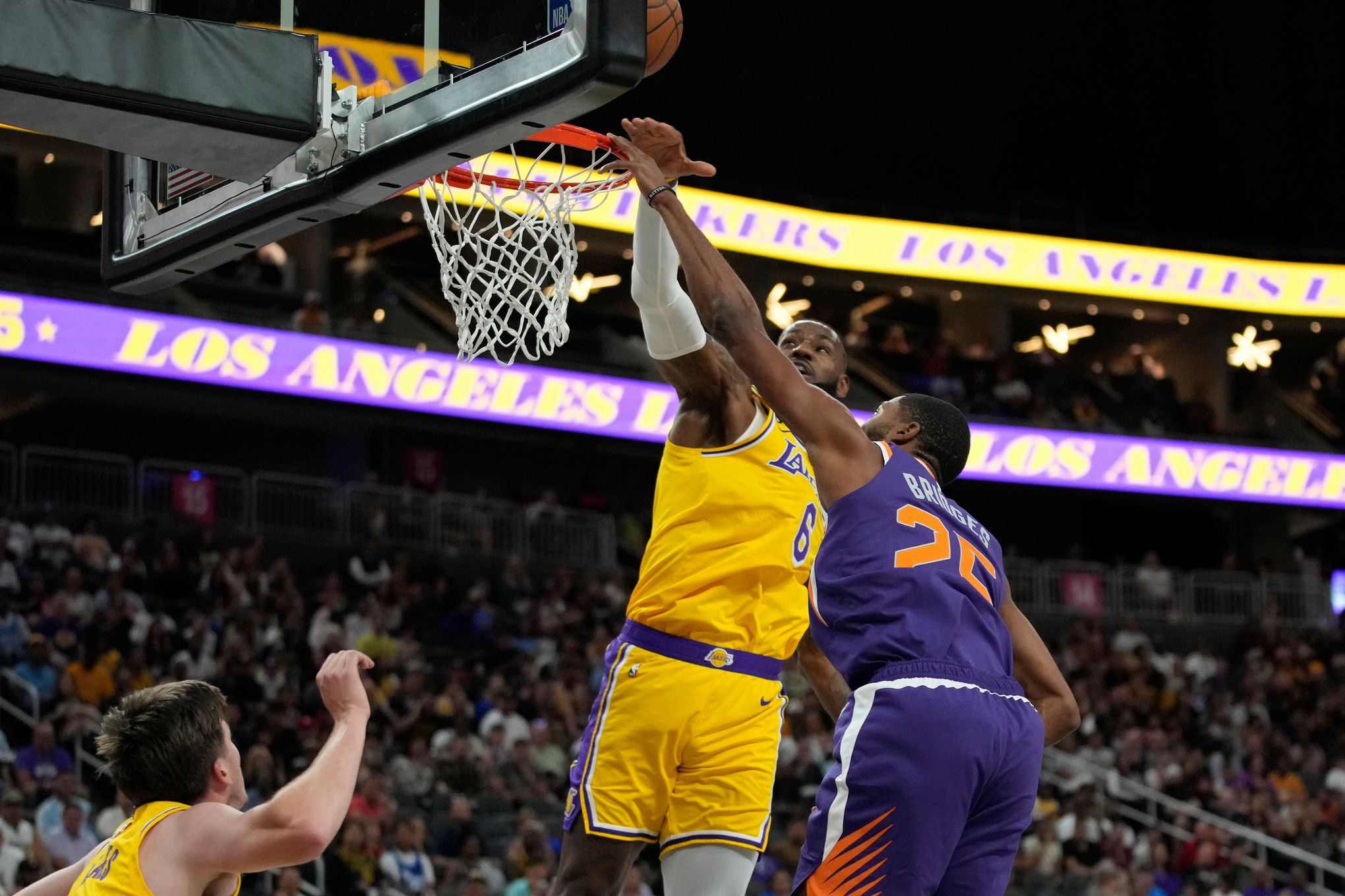 James, Lakers hold off Memphis in overtime