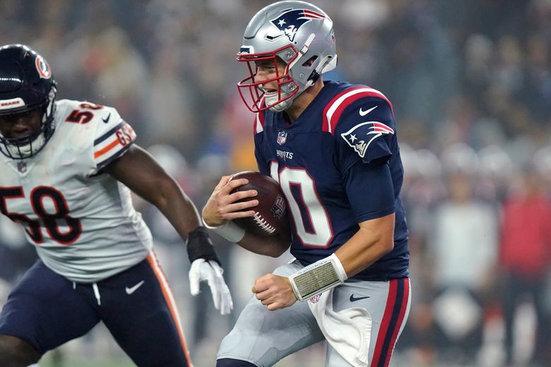 New England Patriots quarterback Mac Jones plays against the Chicago Bears  during the first half of an NFL football game, Monday, Oct. 24, 2022, in  Foxborough, Mass. (AP Photo/Michael Dwyer Stock Photo 