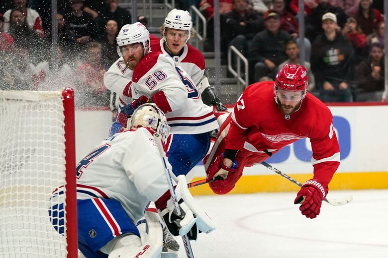 Detroit Red Wings' Michael Rasmussen, right, celebrates his goal