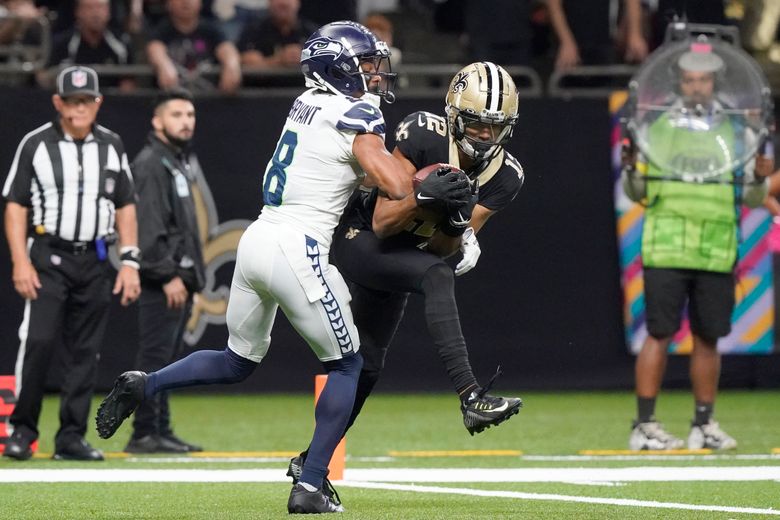 New Orleans Saints wide receiver Chris Olave bodies fellow rookie Seattle  Seahawks cornerback Coby Bryant for TD catch