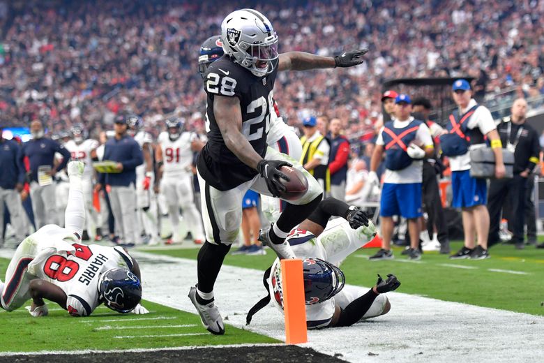 Las Vegas Raiders running back Josh Jacobs (28) gains yards on a