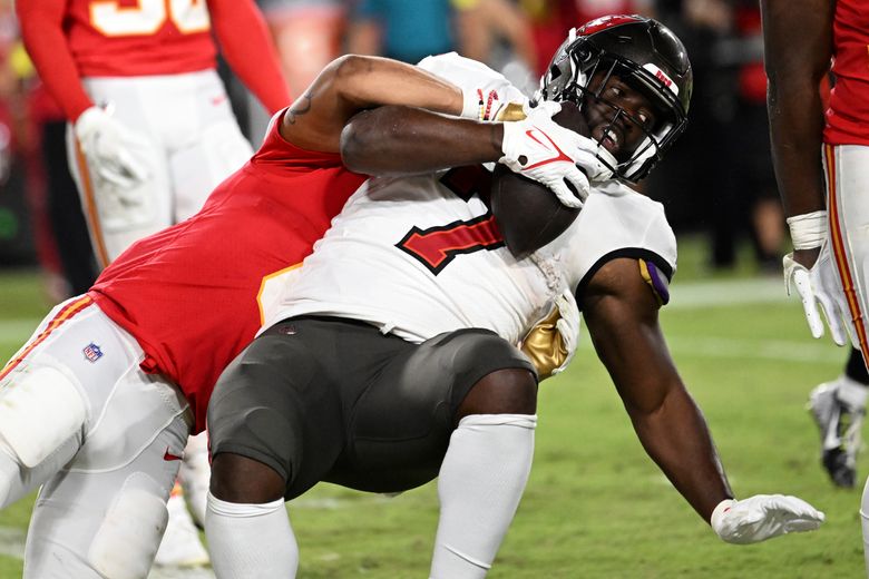 Tampa Bay Buccaneers' Leonard Fournette (7) is tackled by