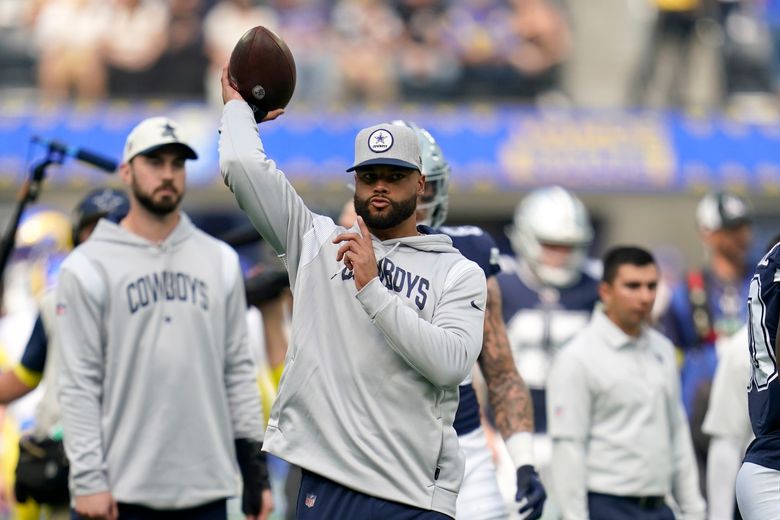 Dallas Cowboys quarterback Cooper Rush warms up before the game