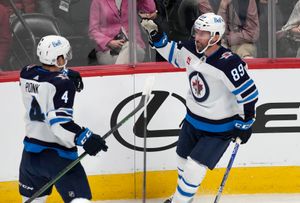 Pionk scores second goal of game in OT, Jets beat Avalanche 4-3 - The Globe  and Mail