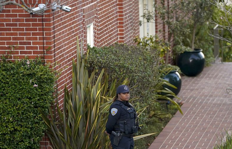 A police officer stands outside the home of House Speaker Nancy Pelosi and her husband Paul Pelosi in San Francisco, Friday, Oct. 28, 2022. Paul Pelosi, was attacked and severely beaten by an assailant with a hammer who broke into their San Francisco home early Friday, according to people familiar with the investigation. (AP Photo/Godofredo A. VÃ(degrees)squez) CAGV505 CAGV505