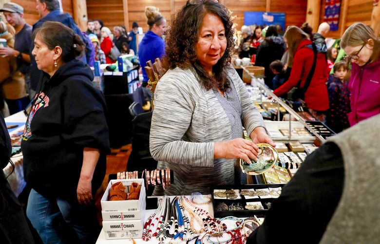 Theresa Jackson-Chun CQ sells her and her children’s artwork during the Duwamish Longhouse and Cultural Center’s CQ annual holiday Native gift fair and art market in West Seattle, at 4705 West Marginal Way SW. Jackson-Chun, who lives in Pierce County, is a Blackfeet artist from the Blackfeet Nation in Montana. “As a traditional Native artist, it blesses my heart to pass down my cultural knowledge to my children & grandchildren, as it was also past down to me by my elders,” Jackson-Chun says. The gift fair and art market will be held Nov. 29-Dec 1, 2019 and Dec. 13-15, 2019. For more information, visit: https://www.duwamishtribe.org/events
LO 212213 212213