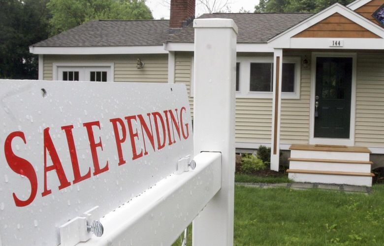 In this 2010 photo, a sign announces a residential home sale is pending in the Boston suburb of Framingham, Mass. (AP Photo/Bill Sikes)