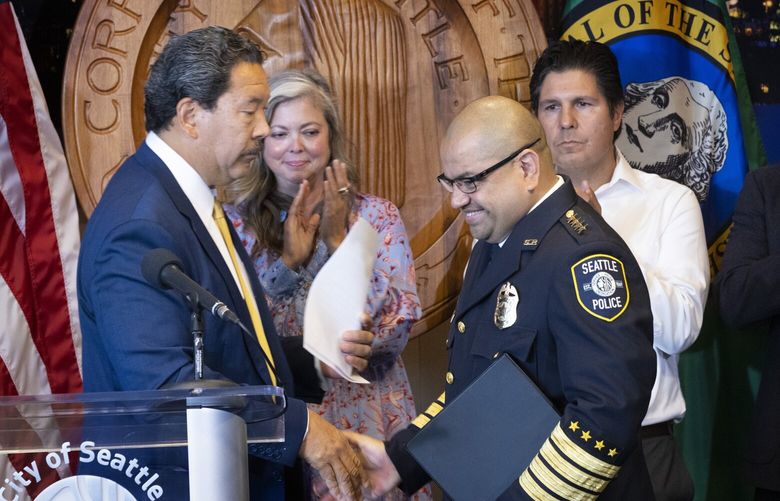 Interim Police Chief Adrian Diaz is all smiles as Seattle Mayor Bruce Harrell introduces him as Seattleâ€™s new police chief at a press conference held at City Hall Tuesday, September 20, 2022. 221618