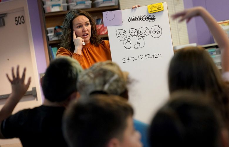 Whittier Elementary School teacher Kayla Cowen interacts with students, Tuesday, Oct. 18, 2022 in Mesa, Ariz. Like many school districts across the country, Mesa has a teacher shortage due in part due to low morale and declining interest in the profession. Five years ago, Mesa allowed Whittier to participate in a program making it easier for the district to fill staffing gaps, grant educators greater agency over their work and make teaching a more attractive career. The model, known as team teaching, allows teachers to combine classes and grades rotating between big group instruction, one-on-one interventions, small study groups or whatever the team agrees is a priority each day. (AP Photo/Matt York)
AZMY207