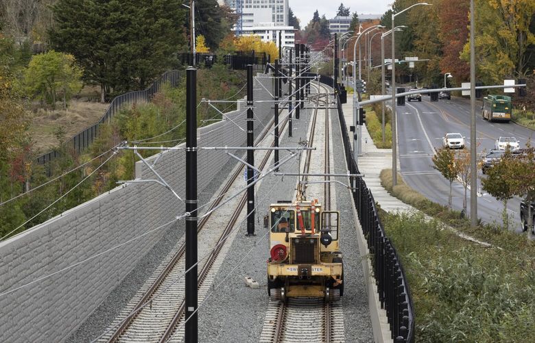A vehicle heads northbound on Sound Transitâ€™s light rail tracks  towards Bellevueâ€™s skyline and the East Main light rail station. At right is 112th Ave. SE. Shot Monday, November 7, 2022.

Sound Transit is considering an Eastside-only starter line so that Bellevue and Redmond can get service soon, rather than wait for contractors to fix flawed work at Mercer Island and Lake Washington.  222060
