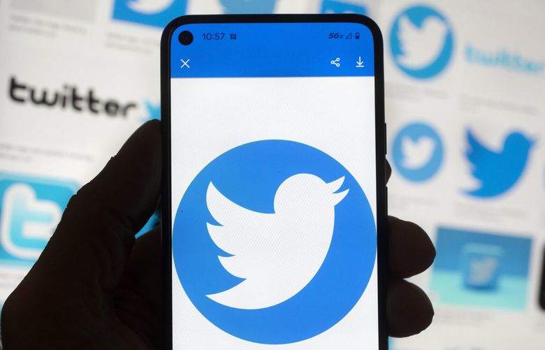 The Twitter logo is seen on a cell phone, Friday, Oct. 14, 2022, in Boston.  (AP Photo/Michael Dwyer) 