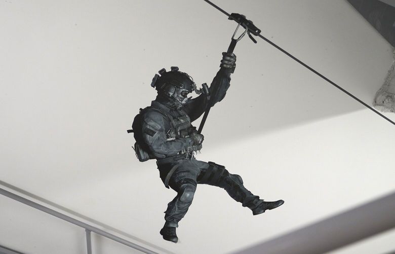 A Call of Duty character hangs on the wall in a stairwell on Friday, Oct. 21, 2022, at Activision Blizzard, Infinity Ward Division, in Woodland Hills, Calif.   The release of Call of Duty: Modern Warfare 2 continues a nearly two-decade run for California-based Activision Blizzard’s wildly popular military shooting game franchise. New installments of the game can rival Hollywood’s biggest blockbusters in how much they earn on their opening weekend. But the battle this time is also happening off-screen as Call of Duty is at the center of a corporate tug-of-war between Microsoftâ€™s Xbox and Sonyâ€™s PlayStation over Microsoft’s pending $69 billion purchase of Activision Blizzard.(AP Photo/Allison Dinner) CAAD614 CAAD614