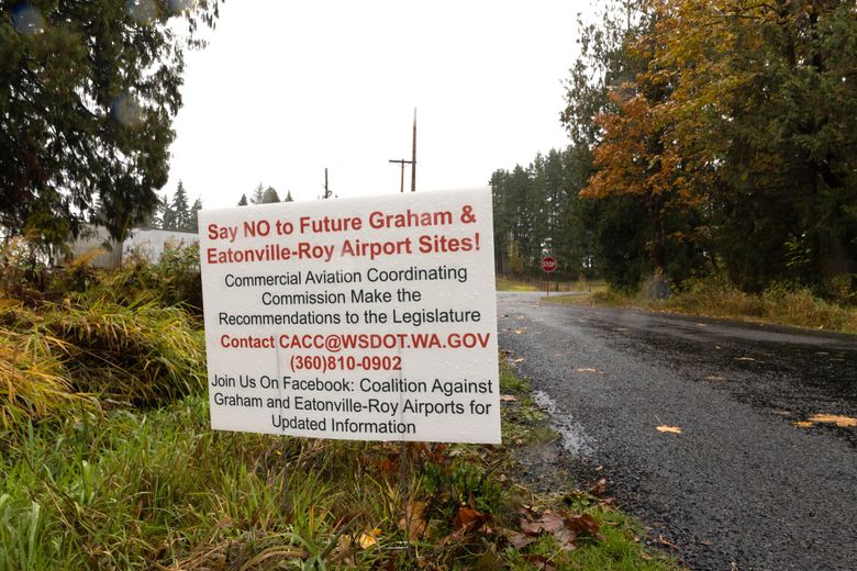 A roadside sign urges people to reject building a new airport near Eatonville in Pierce County. (Karen Ducey / The Seattle Times)