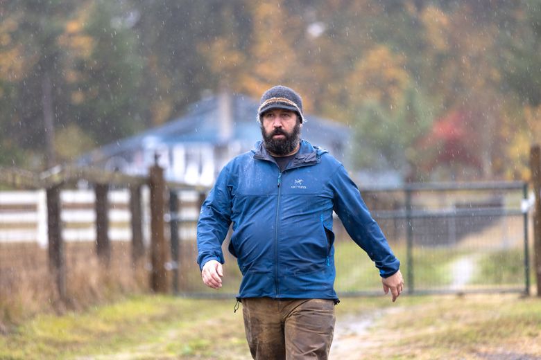 Jeremy Foust, 45, owns Left Foot Farm in Eatonville, where he keeps dairy goats and chickens and rents some cabins through Airbnb. The father of four says if an airport were built here, his livelihood would disappear. (Karen Ducey / The Seattle Times)