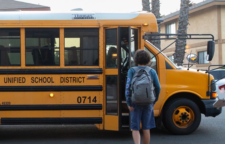 Beth Petersen’s son walks towards the bus that will take him to his Murrieta, Calif., middle school, Oct. 17, 2022. (Credit: Zoë Meyers for the Center for Public Integrity)