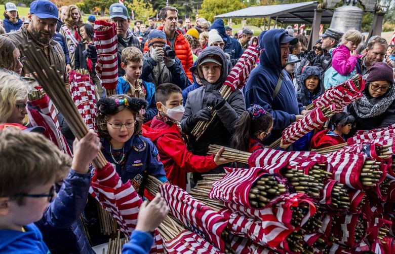 About 7,000 flags were placed next to headstones at Lower Veterans Memorial Cemetery at Evergreen Washelli on Nov. 11, 2022.