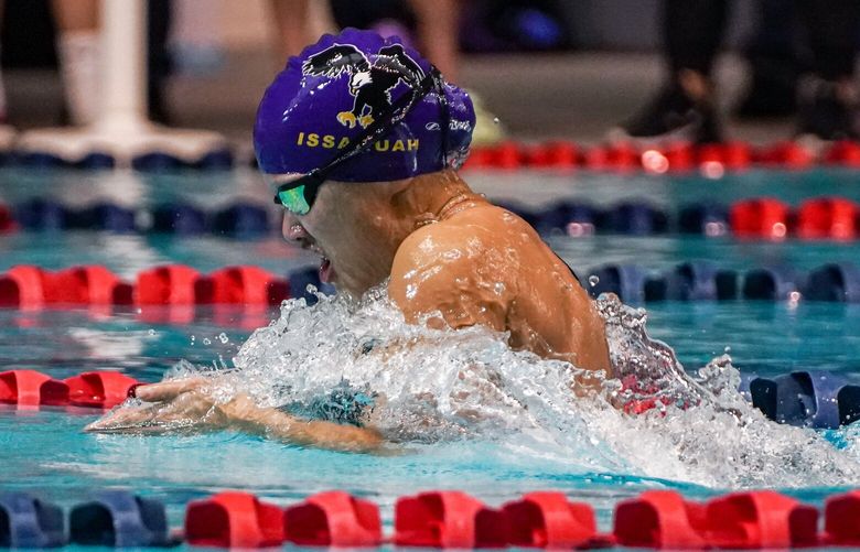 Issaquah High School senior Gillian Tu competes in the 100 yard breaststroke during the WIAA 4A girls state swimming and diving championship at the Weyerhaeuser King County Aquatic Center on Saturday, Nov. 12, 2022. She later won the event.