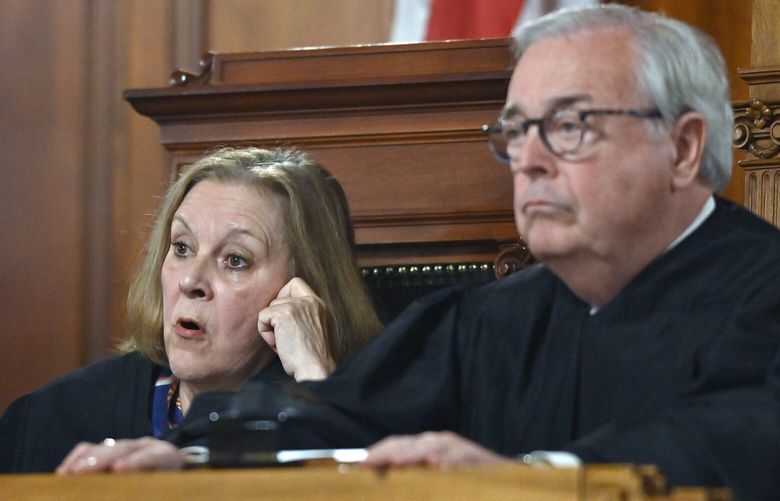 Kentucky Supreme Court Justice Lisabeth Hughes, left, asks a question as Kentucky Supreme Court Chief Justice John D. Minton Jr. listens during arguments before the court whether to temporarily pause the state’s abortion ban in Frankfort, Ky., Tuesday, Nov. 15, 2022. (AP Photo/Timothy D. Easley) KYTE113 KYTE113