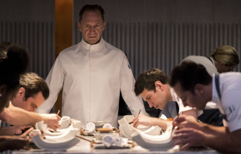 This image released by Searchlight Pictures shows Ralph Fiennes, center, in a scene from the film “The Menu.” (Eric Zachanowich/Searchlight Pictures via AP) NYET122