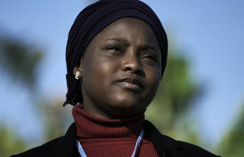 Nakeeyat Dramani Sam, of Ghana, poses for photos at the COP27 U.N. Climate Summit, Friday, Nov. 18, 2022, in Sharm el-Sheikh, Egypt. She made a plea for negotiators at the summit to come to an agreement that could help curb global warming. (AP Photo/Nariman El-Mofty) CLI167 CLI167