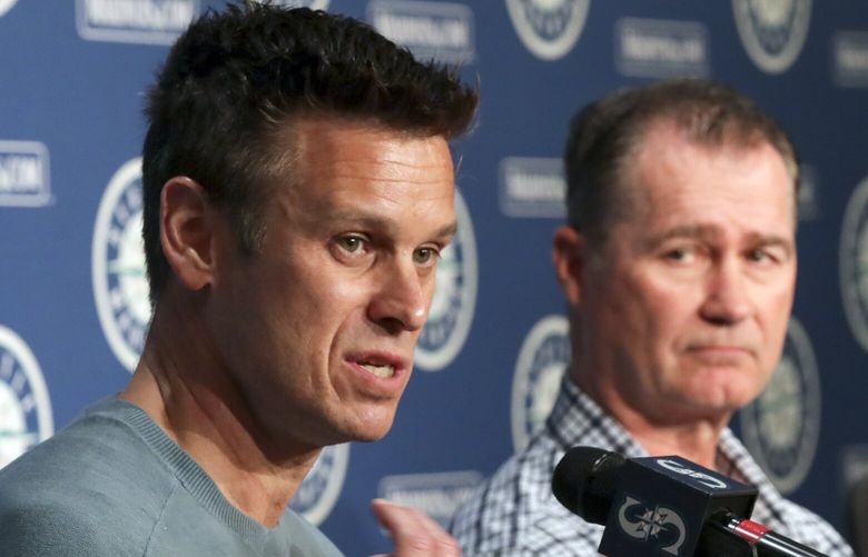 Jerry Dipoto, left, answers a question with Scott Servais during a post playoff press conference at T-Mobile Park in Seattle, Washington on October 19, 2022.