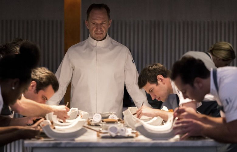 This image released by Searchlight Pictures shows Ralph Fiennes, center, in a scene from the film “The Menu.” (Eric Zachanowich/Searchlight Pictures via AP) NYET122