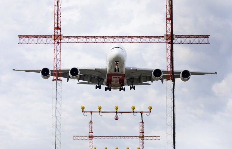 An Airbus SE A380-800 Emirates commercial airliner prepares to land at Toronto Pearson International Airport in Canada. Photographer: Brent Lewin/Bloomberg