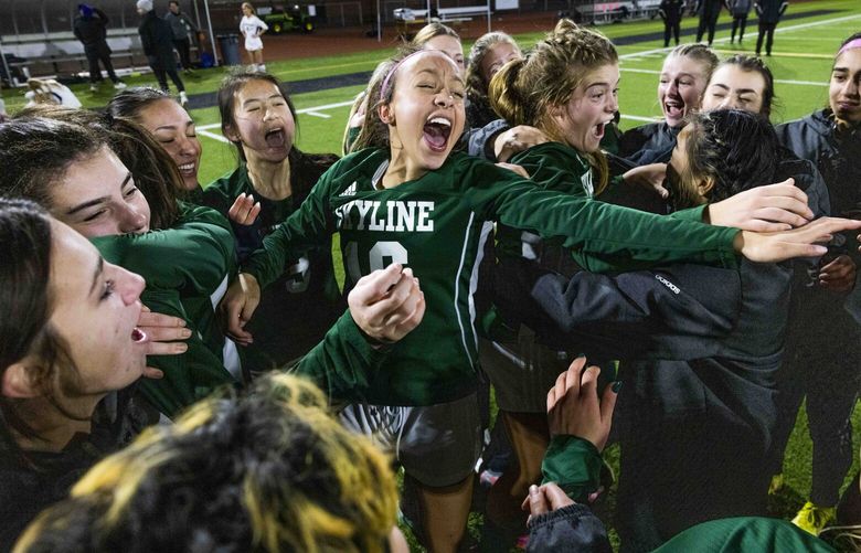 Skyline High School Ariana Ellison (16), center, celebrates with her team after they won during the second half of the WIAA 4A girls soccer championship between Roosevelt and Bellevue High Schools at Sparks Stadium in Puyallup on Nov. 19, 2022.