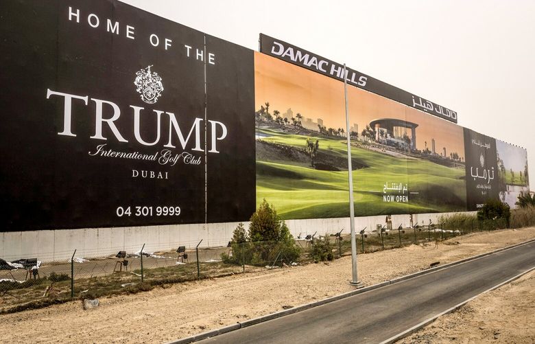 FILE — A billboard advertising a Trump International Golf Course, one of the properties the Trump family has licensed its name to, alongside a highway in Dubai, United Arab Emirates, on Feb. 2, 2017. The government of Oman is a partner in a real estate deal signed last week by former President Donald Trump, intensifying questions about a potential conflict as he seeks the White House again. (Bryan Denton/The New York Times)
 XNYT107
