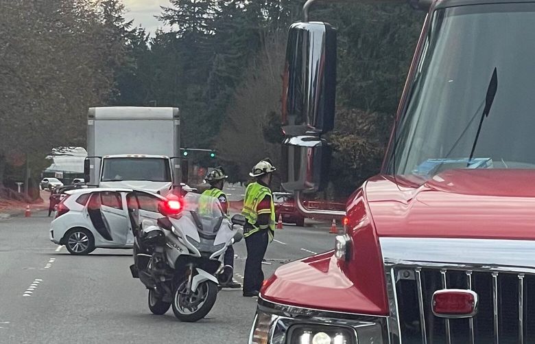 Bellevue Way closed in both directions after a 34-year-old Bellevue motorcycle officer was struck in a collision on Nov. 21, 2022.