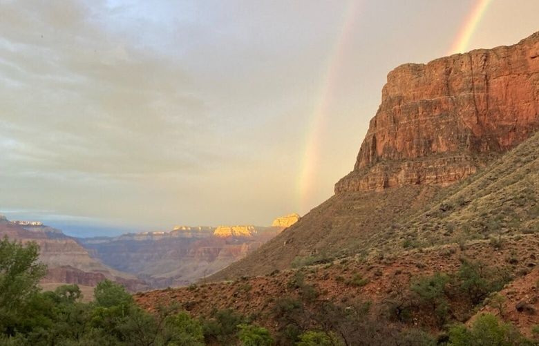 This August 2022 photo provided by the National Park Service shows a double rainbow from the ranger station porch at Indian Garden, which is now called Havasupai Gardens, in Grand Canyon National Park. The Indian Garden name assigned to a popular Grand Canyon campground has been changed out of respect for a Native American tribe that was displaced by the national park. The Havasupai Tribe and Grand Canyon National Park announced Monday, Nov. 21, that Indian Garden will be renamed Havasupai Gardens. (National Park Service via AP) NYSS207 NYSS207