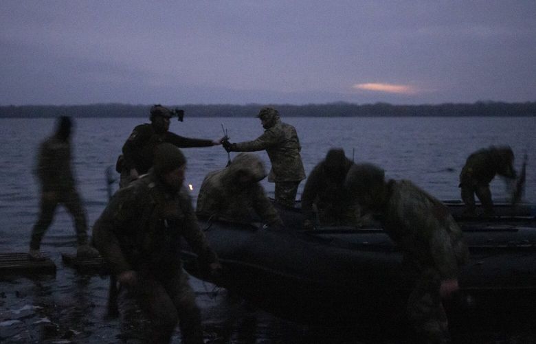 **EMBARGO: No electronic distribution, Web posting or street sales before 12:01 a.m. ET Tuesday, Nov. 22, 2022. No exceptions for any reasons. EMBARGO set by source.** FILE — Members of a special forces unit of the Bratstvo battalion return after conducting a night time operation targeting Russian forces behind the frontline, along the banks of the Dnipro river in Southern Ukraine, Nov. 6, 2022. Ukraine is on the offensive along most of a 600-mile frontline, and the Russians are in a defensive crouch. But about one-fifth of Ukrainian territory is still occupied by Russia. (Ivor Prickett/The New York Times) XNYT227 XNYT227