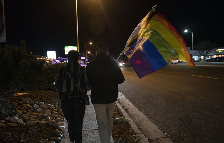 Matt Radcliffe, right, and his partner William Feight walk to join the vigil for the victims of the mass shooting, at the memorial near Club Q in Colorado Springs, Colo., on Nov. 21, 2022. (Daniel Brenner/The New York Times) XNYT306 XNYT306