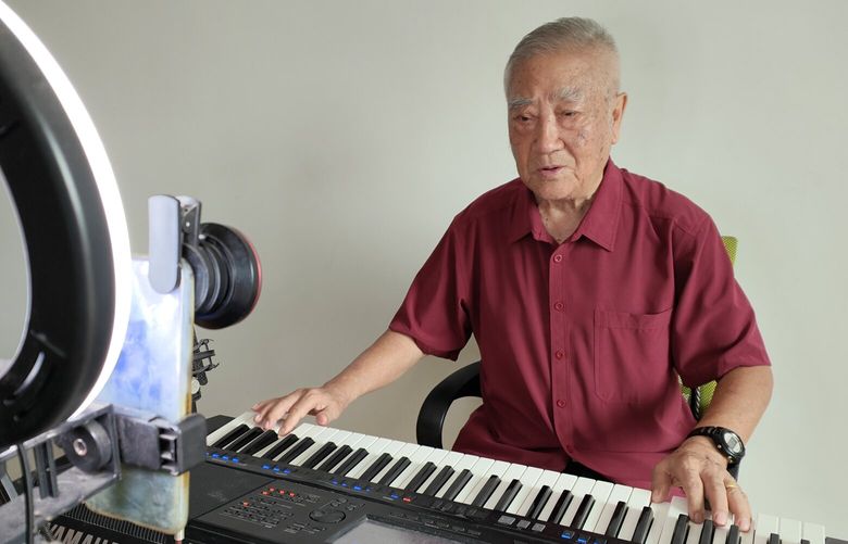 In photo provided by Tang Rui shows, Tang Shikun, who started filming himself singing in 2020, and has about a thousand viewers who tune in each session, in an undated photo. Rapping grannies, crooning 70-year-olds and gamers in their 80s are challenging traditional Chinese views about aging and what it means to have a long and happy life. (Tang Rui via The New York Times) — NO SALES; FOR EDITORIAL USE ONLY WITH NYT STORY CHINA OLDER INFLUENCERS BY STEVENSON AND WANG FOR NOV. 22, 2022. ALL OTHER USE PROHIBITED. —