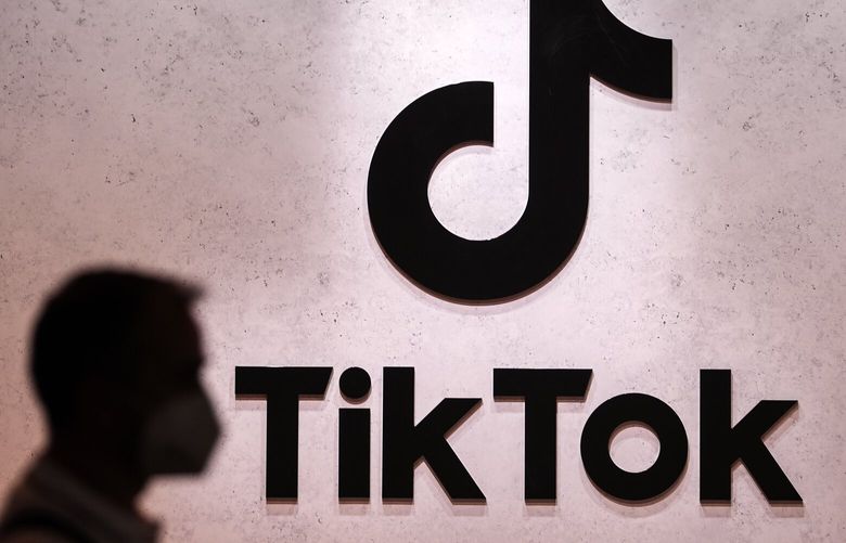 FILE – A visitor passes the TikTok exhibition stands at the Gamescom computer gaming fair in Cologne, Germany, Thursday, Aug. 25, 2022. A Russian court has fined TikTok for failing to delete LGBT material in what is the countryâ€™s latest crackdown on Big Tech companies. The court in Moscow on Tuesday, Oct. 4, 2022 issued the $50,000 penalty to the short-video sharing platform, following a complaint by Russian regulators. TikTok, which is owned by Chinaâ€™s ByteDance Ltd., didnâ€™t immediately respond to a request for comment. (AP Photo/Martin Meissner, File)