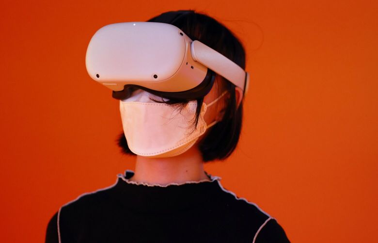 An attendee wears a Meta Quest 2 virtual reality (VR) headset to play a video game at the Tokyo Game Show 2022 in Chiba, Japan, on Thursday, Sept. 15, 2022. The show runs through to Sept. 18. Photographer: Kiyoshi Ota/Bloomberg
