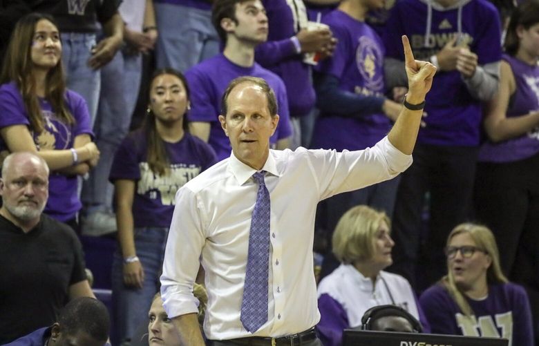 Washington Huskies head coach Mike Hopkins signals to the player on court Monday evening at Alaska Airlines Arena in Seattle, Washington on November 7, 2022.