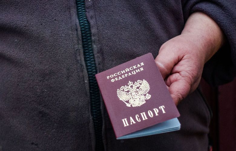 Sasha, 60, who obtained a Russian passport to get money to provide for his family and receive free medical supplies. MUST CREDIT: Photo for The Washington Post by Wojciech Grzedzinski.