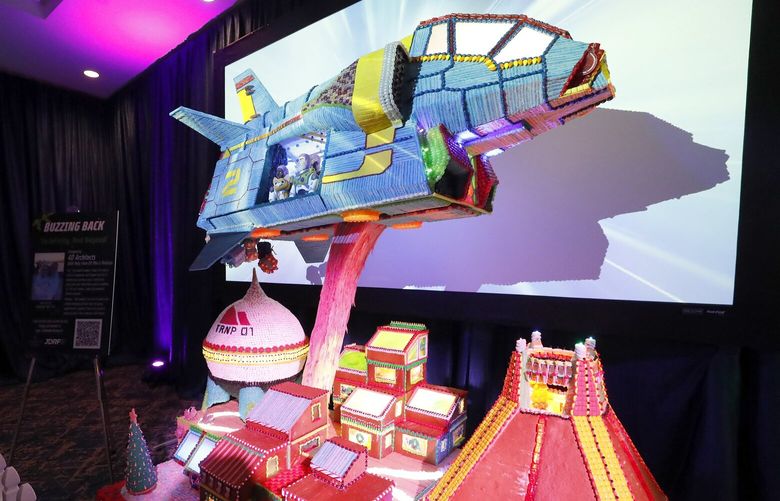 At Gingerbread Village, which is back for the first time since 2019, includes “To Infinity and Beyond” with the help of sisters Madison and Mia Sledge and designers at 4D architects at the dowmtown Sheraton Grand in Seattle,  Monday, November 21. The  creation of the four villages were achieved with the design abilities of local architecture firms 4D Architects, Master Builders Asssociation and Gelotte Hommas Drivdahl, MG2 and CallisonRTKL along with the help of Sheration’s pastry chefs, who started in September. This is the 28th year for the Gingerbread Village, which is free. Donations are suggested and benefit JDRF (Juvenile Diabetes Research Foundation) Northwest Chapter. The display, off the lobby of the hotel, is open every day through January 1, 2023 from 9:00am to 9:00pm, Friday and Saturday the show is extended to 11:00pm. 

LO LO LO

 222216