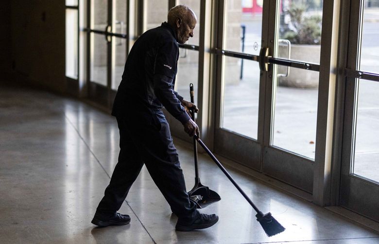 Alem Birhan Taye, works on tidying the Lumen Field Event Center during his shift on Nov. 16, 2022.