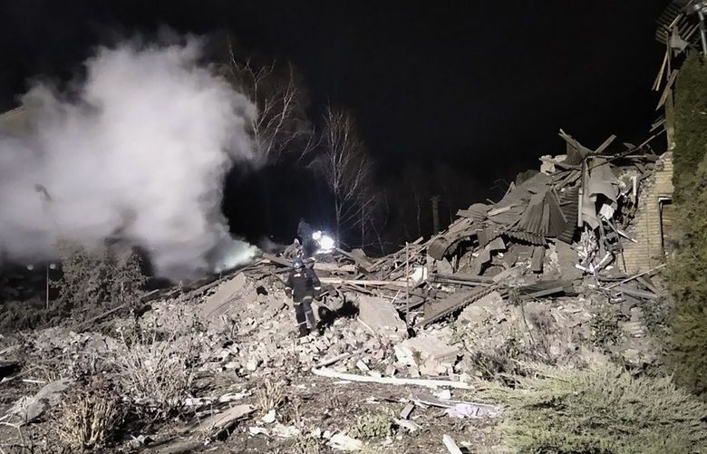 In this photo provided by the Zaporizhzhia region military administration, Ukrainian firefighters work at damaged hospital maternity ward in Vilniansk, Zaporizhzhia region, Ukraine, early Wednesday, Nov. 23, 2022. An overnight rocket attack struck a hospital maternity ward in southern Ukraine, killing a newborn baby, Ukrainian authorities said Wednesday. The baby’s mother and a doctor were pulled alive from the rubble. The region’s governor said the rockets were Russian. (Zaporizhzhia region military administration via AP) XSG101 XSG101