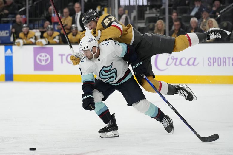 Vegas Golden Knights defenseman Shea Theodore, right, collides with Seattle Kraken right wing Jordan Eberle (7) during the third period of an NHL hockey game Friday, Nov. 25, 2022, in Las Vegas. (John Locher / The Associated Press)