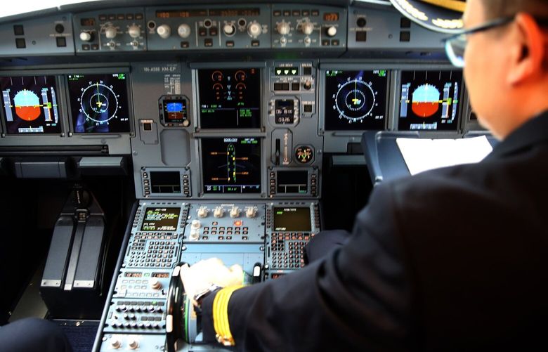 A pilot adjusts flight controls inside a cockpit on board an Airbus SE A321 Neo aircraft, operated by FLC Group JSC Bamboo Airways, at Noi Bai International Airport in Hanoi, Vietnam, on Wednesday, Jan 16, 2019. The International Air Transport Association forecasts Vietnam will be among the world’s top five fastest-growing air travel markets in the next 20 years. Photographer: Maika Elan/Bloomberg 775283337