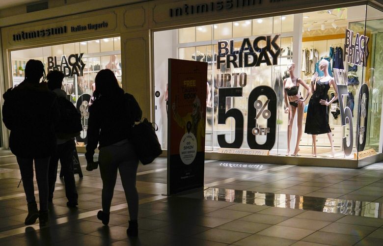 Intimissimi posts Black Friday discounts in their display windows during early Black Friday shopping in Fashion Centre at Pentagon City in Arlington, Va., Friday, Nov. 25, 2022. VACK108