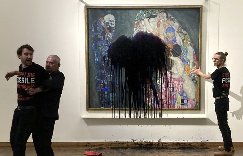Austrian activists of “last generation Austria” have splashed a Gustav Klimt painting with oil in the Leopold museum in Vienna, Austria, Tuesday, Nov.15, 2022. The painting is behind a glass cover and was unharmed. (AP Photo/Letzte Generation Oesterreich) PRO115 PRO115