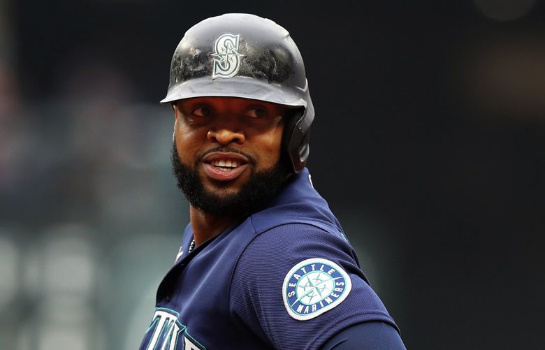 Mariners designated hitter Carlos Santana reaches first base during the last game of the regular season against the Tigers, Wednesday, Oct. 5, 2022 in Seattle.