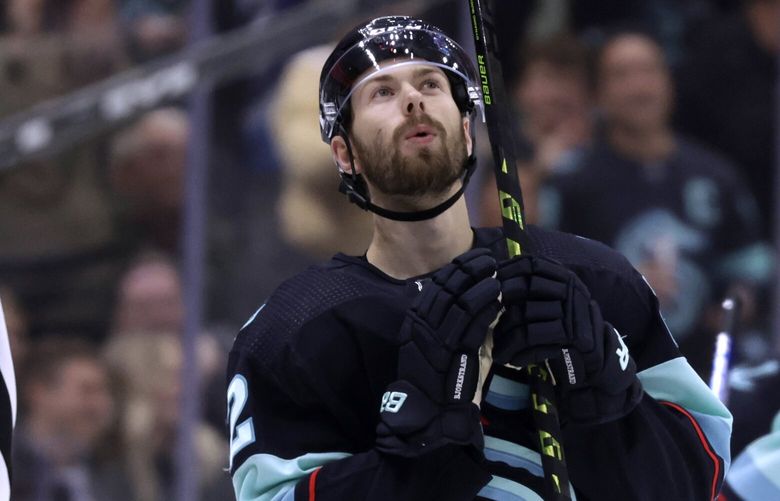 Seattle Kraken right wing Oliver Bjorkstrand (22) looks up as he skates to the bench after scoring against the San Jose Sharks during the third period of an NHL hockey game Wednesday, Nov. 23, 2022, in Seattle. The Kraken won 8-5. (AP Photo/John Froschauer) WAJF112 WAJF112